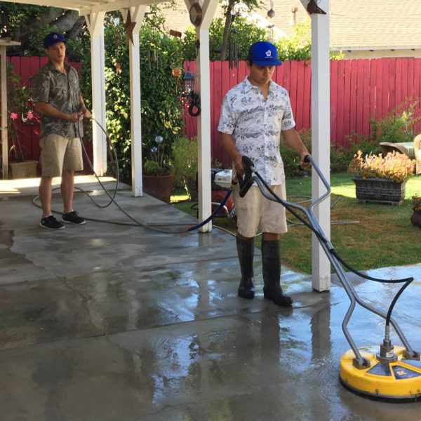 Big Wave service professionals performing flat surface concrete cleaning